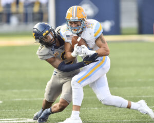 Charles Woods’ interception and fumble recovery highlight D-FW homecoming, helps seal WVU win over TCU